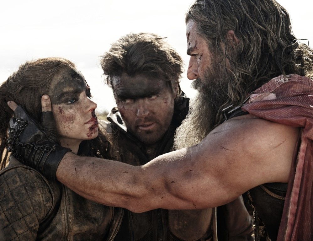 Anya Taylor-Joy as Furiosa, Tom Burke as Praetorian Jack and Chris Hemsworth as Dementus in Warner Bros. Pictures' Furiosa: A Mad Max Saga. Photo Credit Jasin Boland.